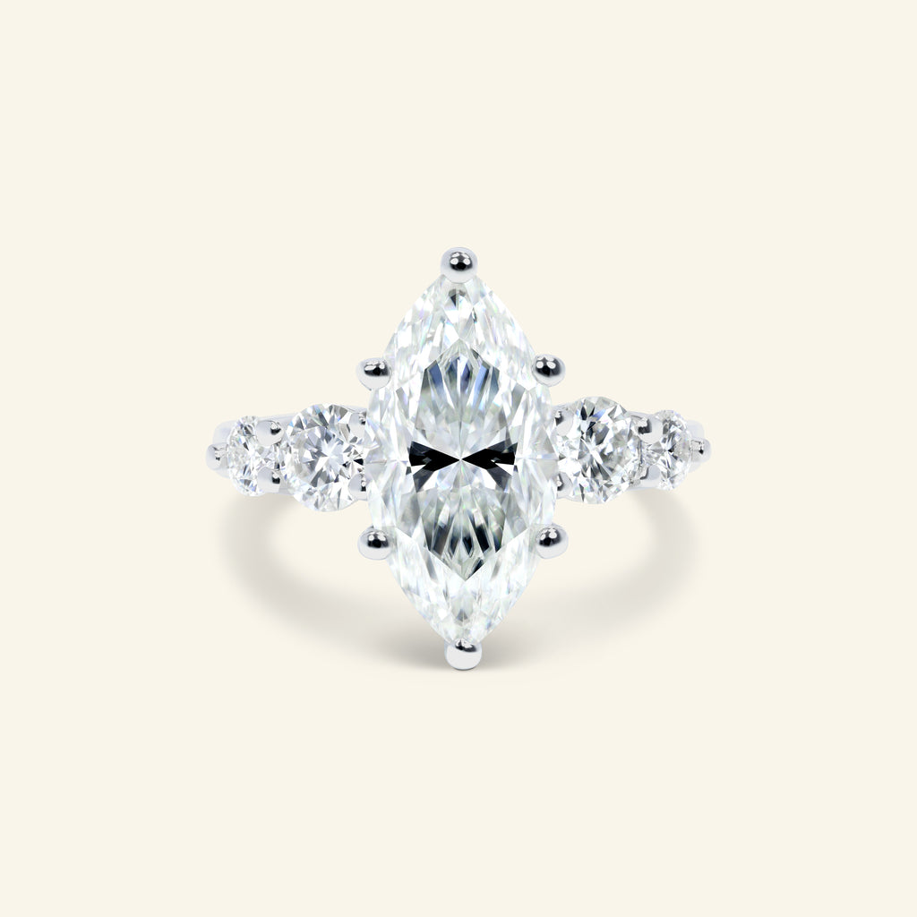 Mia Marquise Ring featuring an elegant marquise center stone with graduated round side stones crafted in polished sterling silver.