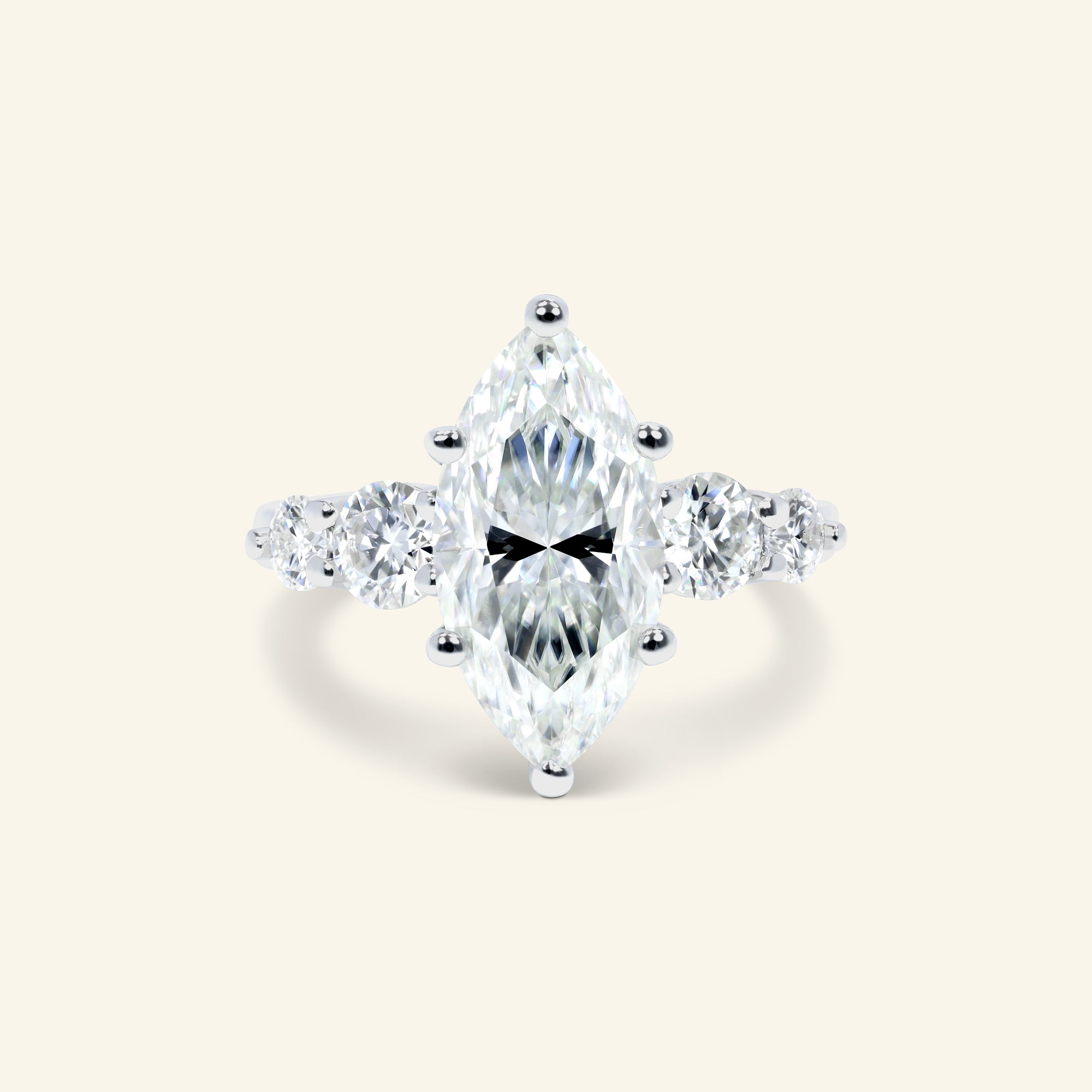 Mia Marquise Ring featuring an elegant marquise center stone with graduated round side stones crafted in polished sterling silver.