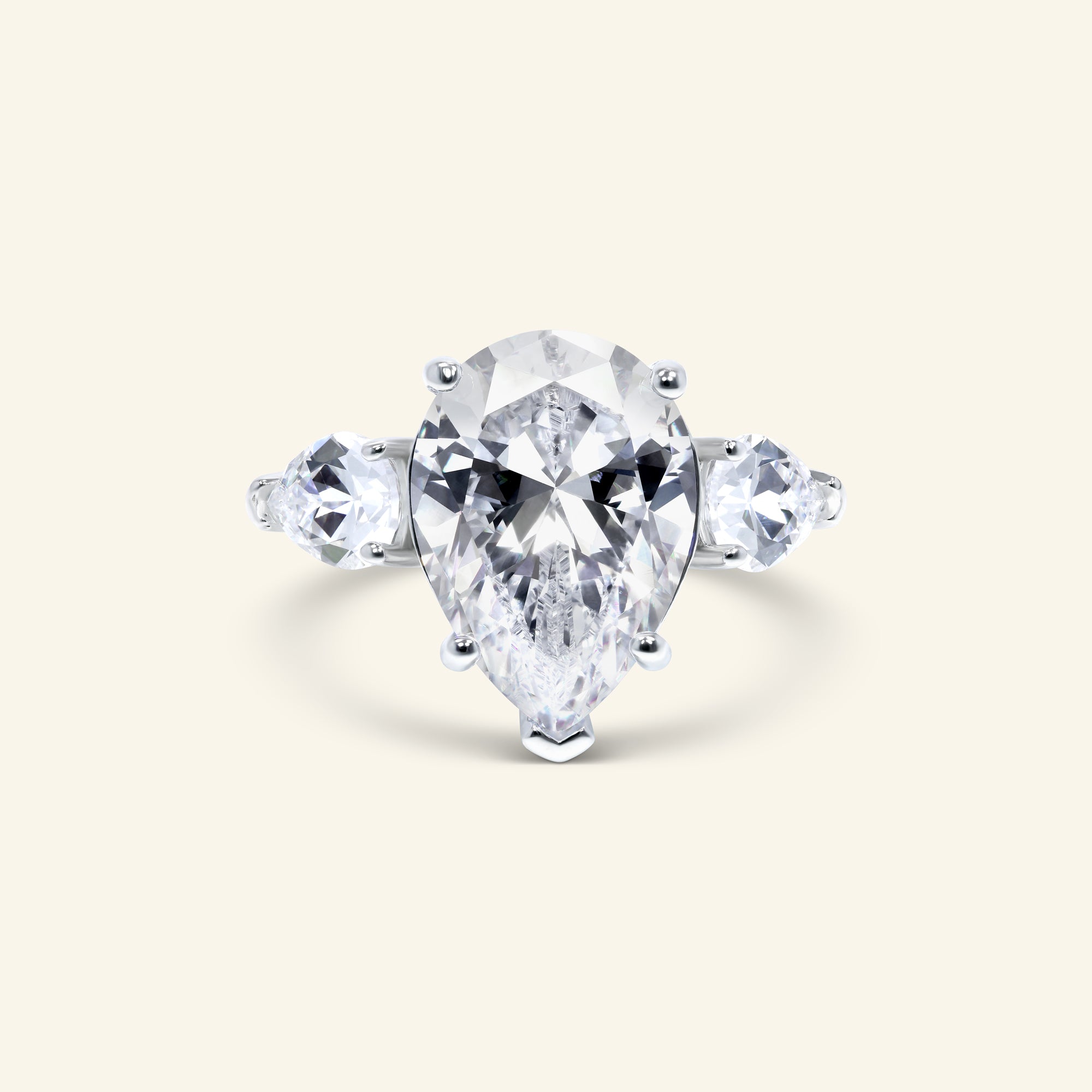 Sora three-stone pear ring with pear side stones by Arvion Jewelry